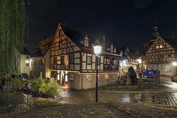 Historic half-timbered houses in the old town at night in autumn rain, Lauf an der Pegnitz, Middle Franconia, Bavaria, Germany, Europe