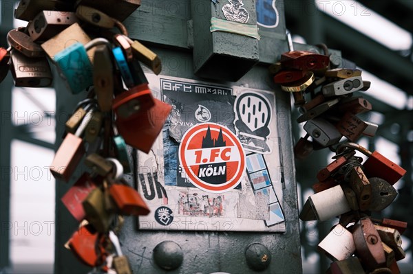 Logo of 1. FC Koeln with love locks on a bridge over the Rhine, Cologne, Germany, Europe