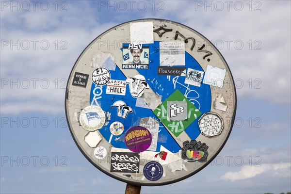 Surfer stickers on road sign at coast Odeceixe, Algarve, Portugal, Southern Europe, Europe