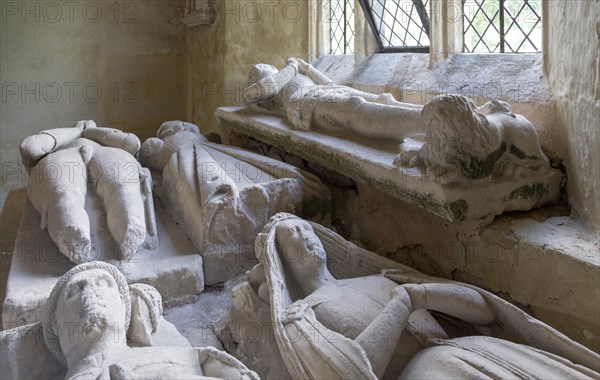 Medieval effigies inside Nunney church, Somerset, England, UK, foreground Sir John Paulet died 1437 his wife Constance