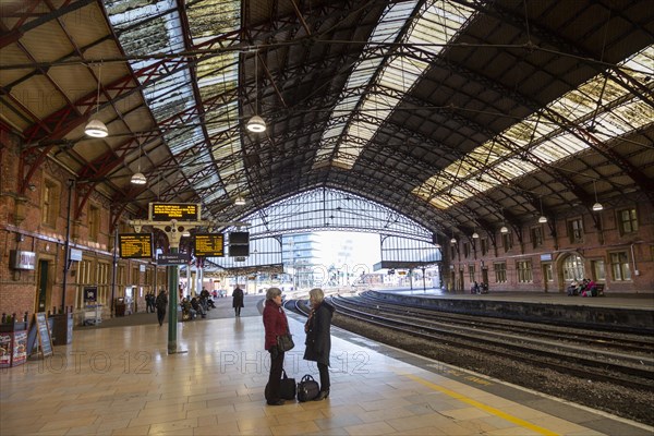 Passengers on platform at Temple Meads railway station, Bristol, England, UK, designed by Isambard Kingdom Brunel