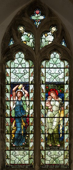 Stained glass window depicting Hope and Love designed by Henry Holiday 1890s, Fressingfield church, Suffolk, England, UK