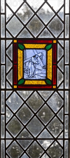 Village parish church Cratfield, Suffolk, England, UK stained glass panel of Jesus Christ carrying Cross