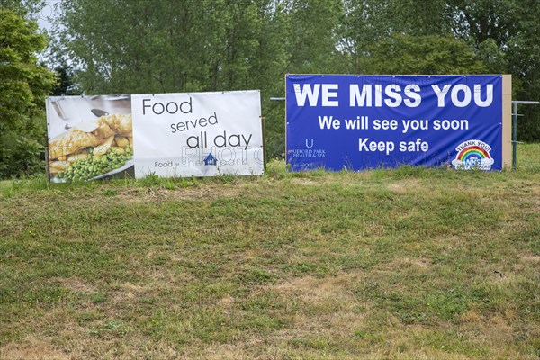 We Miss You sign on business closed during Coronavirus Covid 19 pandemic, Ufford Park, Suffolk, England, UK June 2020