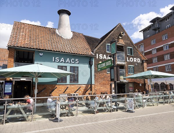 People sitting outside newly reopened Isaacs pub on the waterfront, Wet Dock, Ipswich, Suffolk, England, UK July 2020