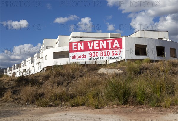 Unfinished housing project property for sale sign, near Alcaucin, La Axarquia, Andalusia, Spain, Europe