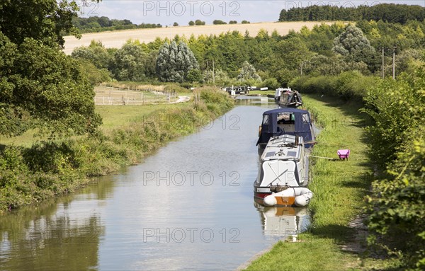 Narrowboats on the Kennet and Avon canal near Crofton, Wiltshire, England, UK