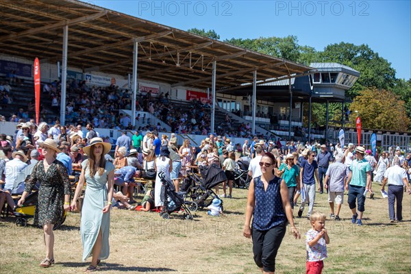 Race day at the racecourse in Hassloch, Palatinate. An estimated 3, 000 to 4, 000 spectators were present in beautiful summer weather and not too hot temperatures