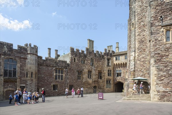 Berkeley castle, Gloucestershire, England, UK built by Robert Fitzharding in 12th century tourist group in castle keep