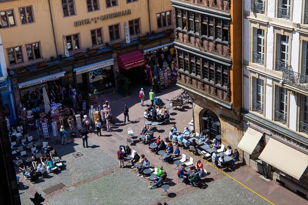 Crowded street cafes and shops in the historic city centre of Strasbourg, France, Europe