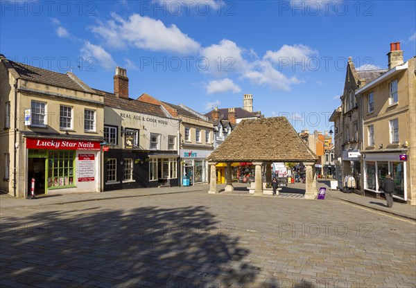 Historic buildings around the 16th century Buttercross, in Market Place, Chippenham, Wiltshire, England, UK