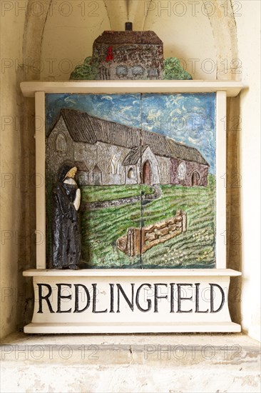 Old village painted sign in porch of Redlingfield church, Suffolk, England, UK, depicting Nun and Benedictine Priory