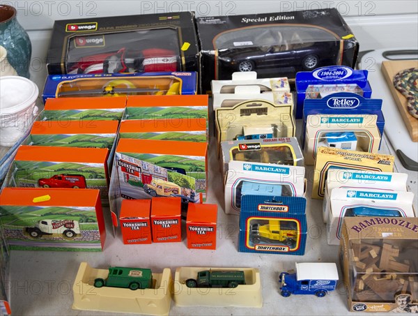 Display of collectible boxed motor vehicle model toys at auction