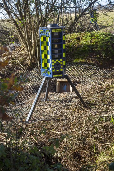 Eviction of badgers clearance of badger sett using metal fencing and one way exit gates, part of HS2 project near Kenilworth, Warwickshire, England, November 2020. Armadillo Videoguard surveillance robots used to observe site and detect protestors