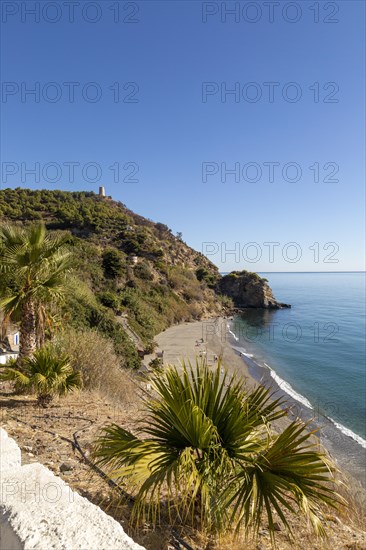 Sandy beach of Playa de Maro, near Nerja, Andalusia, Spain with calm Mediterranean Sea, out of season