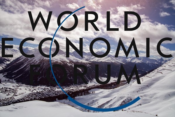 Logo of the WEF (World Economic Forum), in the background Davos from above