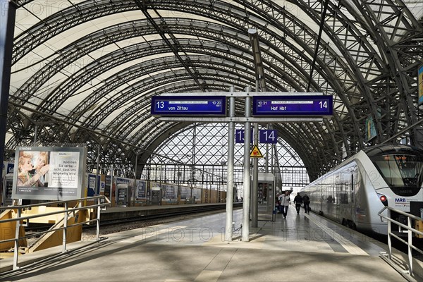 Railway station central railway station Hbf Deutsche Bahn DB with trains symmetrical panorama in Dresden, Germany, Europe
