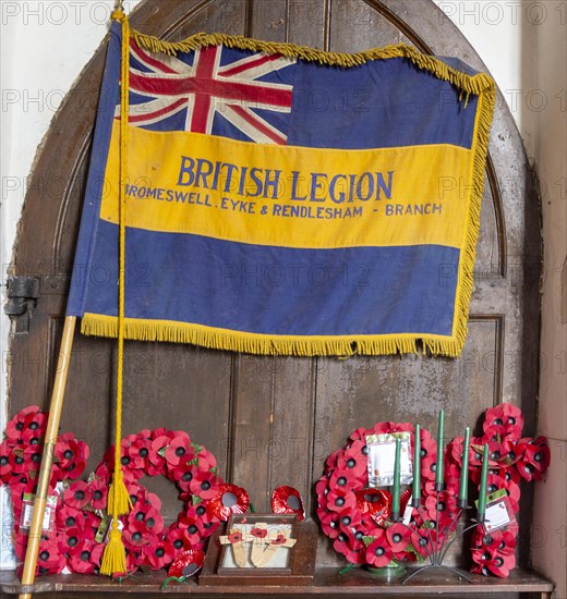 Village parish church All Saints, Eyke, Suffolk, England, UK, British Legion flag banner