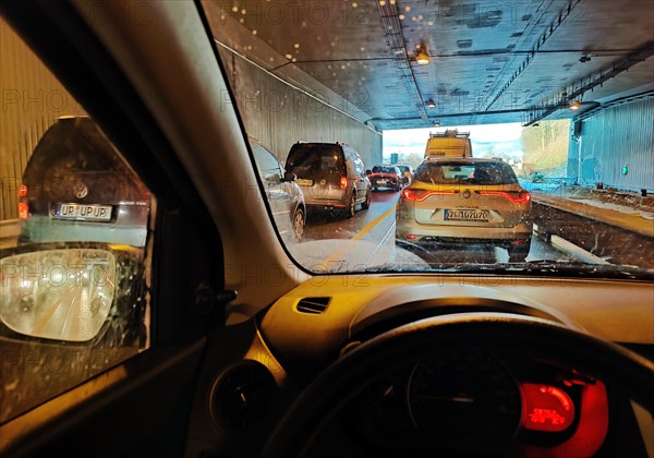 View from a car in a tunnel on the A 52 motorway with heavy traffic, Essen, Ruhr area, Germany, Europe