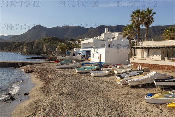 Small boats dinghies on sandy beach at Isleta del Moro, Cabo de Gata natural park, Almeria, Spain, Europe