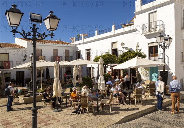 People and cafes in church square plaza, Plaza de la Iglesia, Frigiliana, Axarquia, Andalusia, Spain, Europe