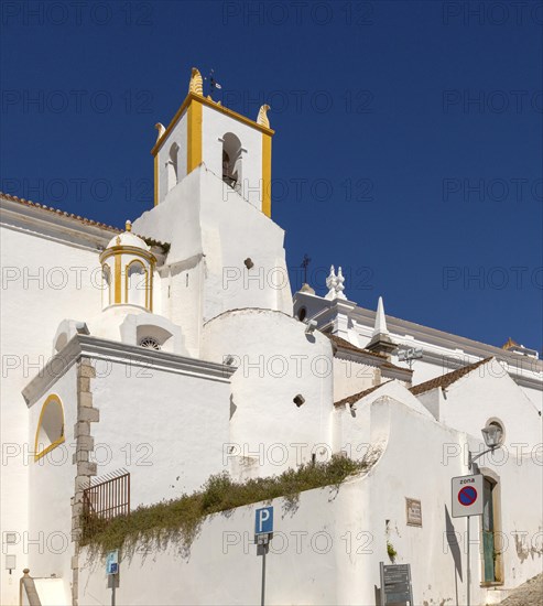 Whitewashed exterior walls and tower of Roman Catholic church Igreja de Santiago, Tavira, Algarve, Portugal, southern Europe, Europe