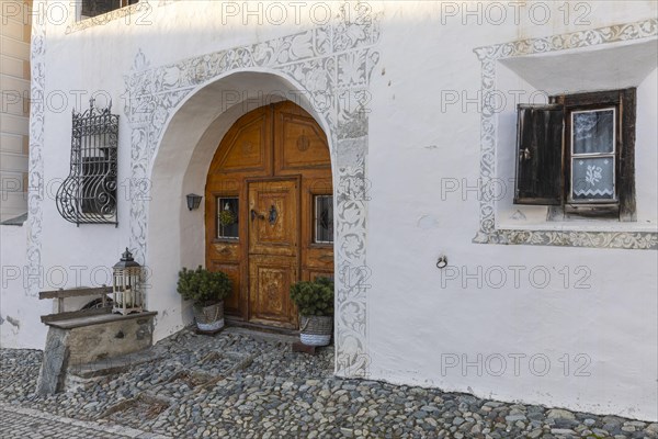 Entrance door, window, historic house, sgraffito, facade decorations, Guarda, Engadin, Grisons, Switzerland, Europe