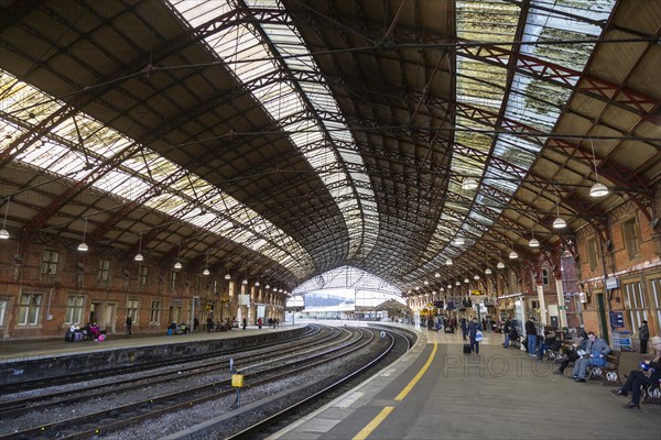 Passengers on platform at Temple Meads railway station, Bristol, England, UK, designed by Isambard Kingdom Brunel