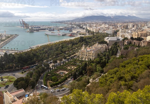 Cityscape view over city centre and dock area Malaga, Andalusia, Spain, Trasmediterranea ferry ship in port, city hall Ayuntamiento centre, Europe