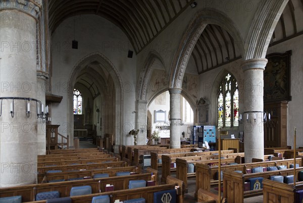 View across the nave to chancel, altar and east window inside the church at church of Saint Mary, Purton, Wiltshire, England, UK