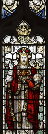 Stained glass window of Jesus Christ in his majesty wearing a crown, church of Saint Mary, Friston, Suffolk, England, UK