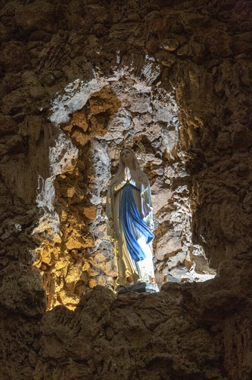 Statue of Blessed Virgin Mary standing in rock grotto ichurch of Igreja de Santiago, Tavira, Algarve, Portugal, Southern Europe, Europe