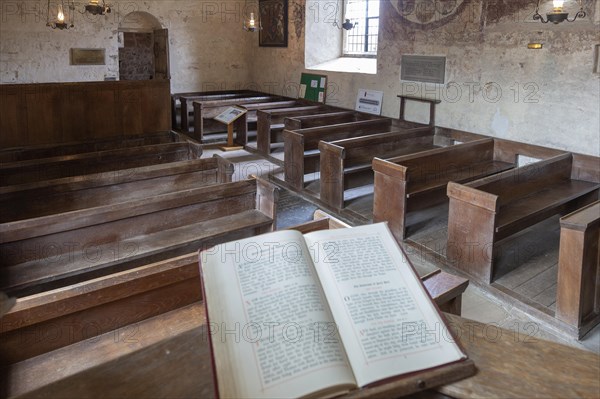 Medieval frescoes church of Saint Mary, Kempley, Gloucestershire, England, UK, bible on pulpit lectern