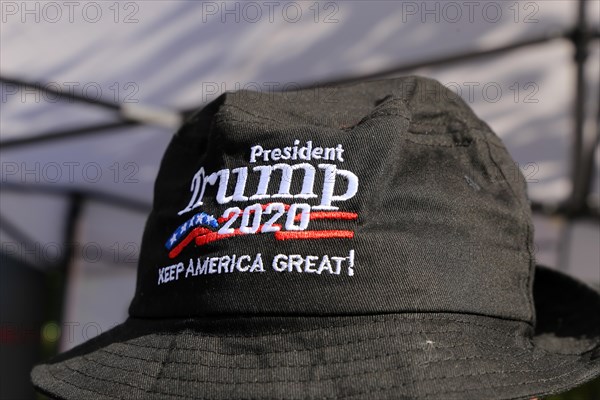 Convinced Trump supporter in Germany wears a cap with the campaign slogan Trump 2020 - keep America great