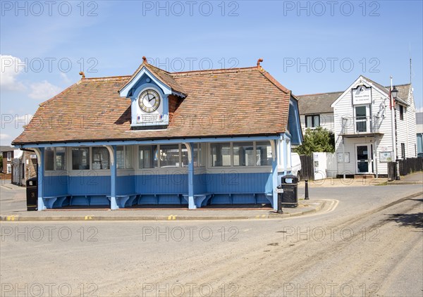 Historic shelter with clock in village centre, Brightlingsea, Tendring, Essex, England, UK