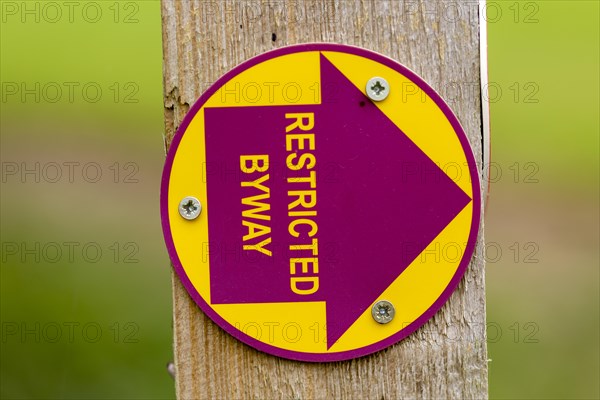 Macro close up of Restricted Byway sign on fencepost, Sutton, Suffolk, UK