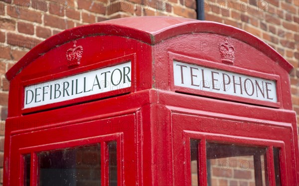 Old red telephone box used now as a defibrillator