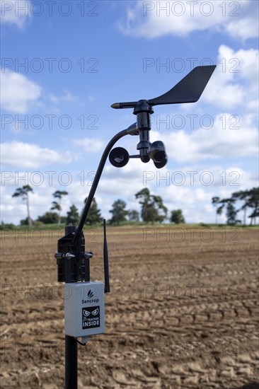 Sencrop Windcrop V7 weather vane anemometer weather station equipment in farm field, Sutton, Suffolk, England, UK