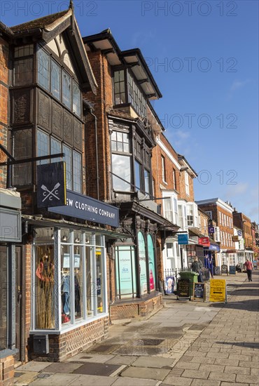 Historic listed buildings shops Marlborough, Wiltshire, England, UK, 106 High Street to left Crew Clothing Company