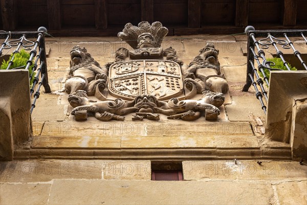 Family coat of arms carved in stone on corner of historic building, San Asensio, La Rioja Alta, Spain, Europe