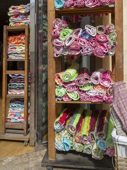 Woven cotton rugs called Jarapas or Harapas, on sale outside shop in village of Nijar, Almeria, Spain, Europe