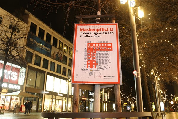 Information board on the obligation to wear masks in Mannheim city centre