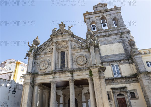 Sixteenth century church of Igreja de Nossa Senhora de Graca, Evora, Alto Alentejo, Portugal, southern Europe built in Italian Renaissance style facade having a portico with Tuscan columns architectural designs by Miguel de Arruda. Two stone Atlas-like figures sit on each corner nicknamed by locals the 'children of Grace', Europe