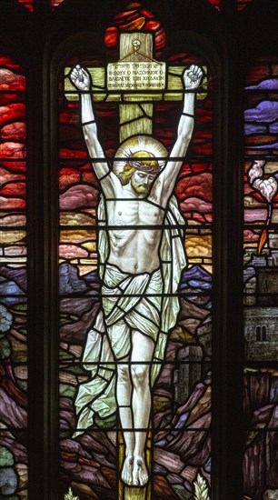 Stained glass window detail church of Saint Mary, Martlesham, Suffolk, England, UK, Crucifixion of Jesus Christ on Cross by Heaton, Butler and Bayne circa 1915