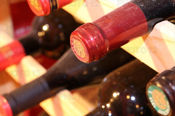 Wine cellar with red wine bottles (editorial)