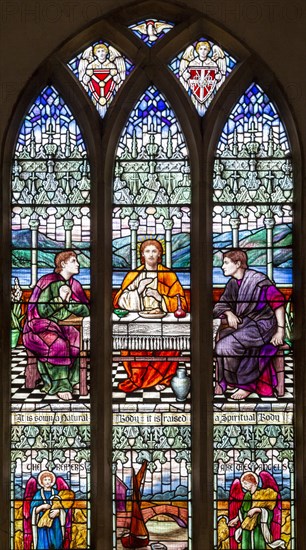 Stained glass east window by M Lowndes c 1920, 'Christ breaking Bread', Snape church, Suffolk, England, UK