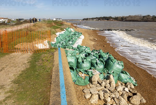 Emergency coastal defences repair work at Felixstowe Ferry, Suffolk, England, UK after storm damage to sea wall in February 2020