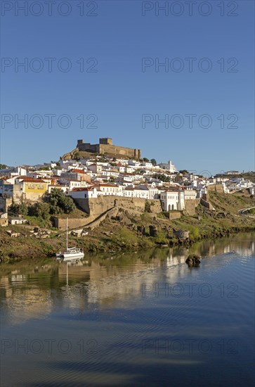 Historic hilltop walled medieval village of Mertola with castle, on the banks of the river Rio Guadiana, Baixo Alentejo, Portugal, Southern Europe, Europe