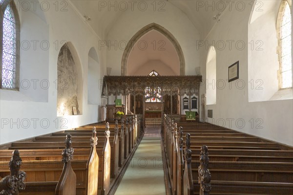 Elaborately decorated wooden rood screen in church of Saint Andrew, Bramfield, Suffolk, England, UK