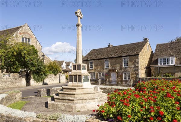 Historic Cotswold stone buildings and war memorial in Canon Square, Melksham, Wiltshire, England, UK